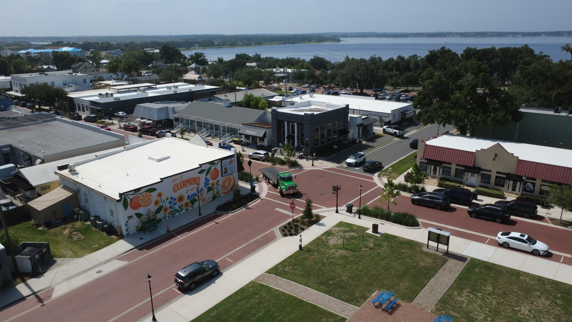 Aerial view of downtown Clermont with the Welcome to Clermont mural and Lake Minneola beyond